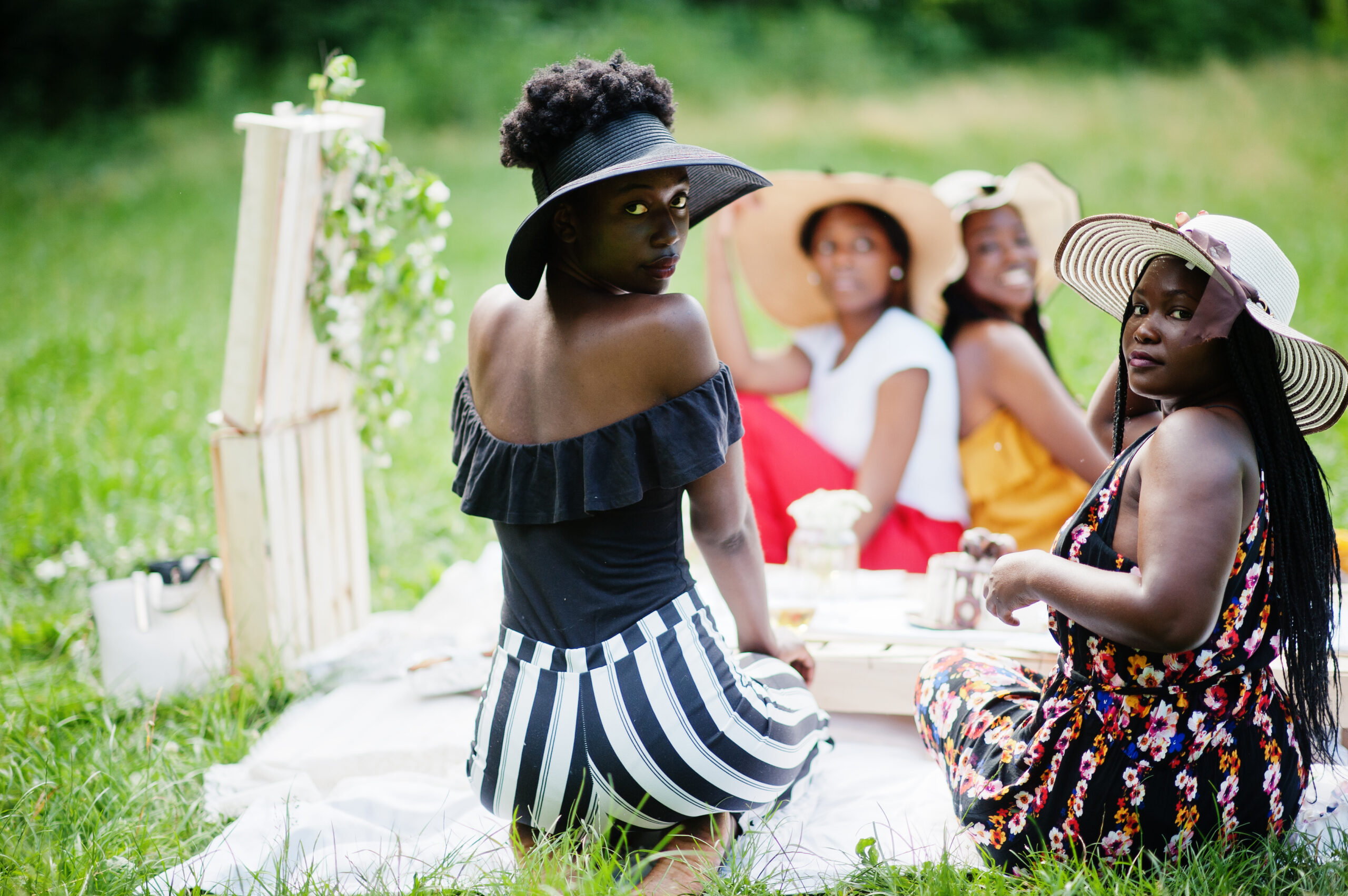 Group of african american girls celebrating birthday party outdoor with decor.